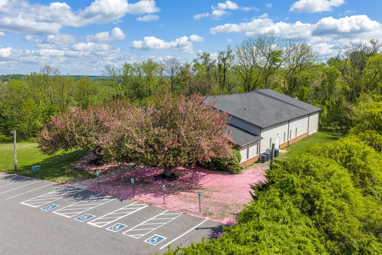 Bethel campus and front parking lot surrounded by trees