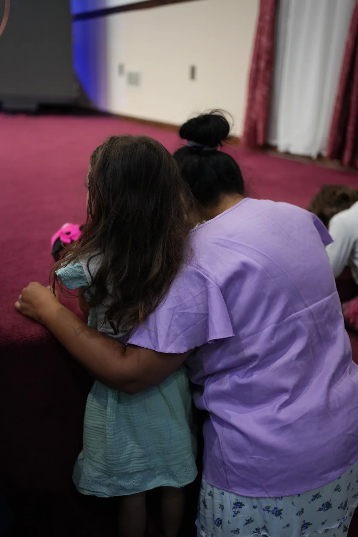 Two children at Bethel with their arms around each other
